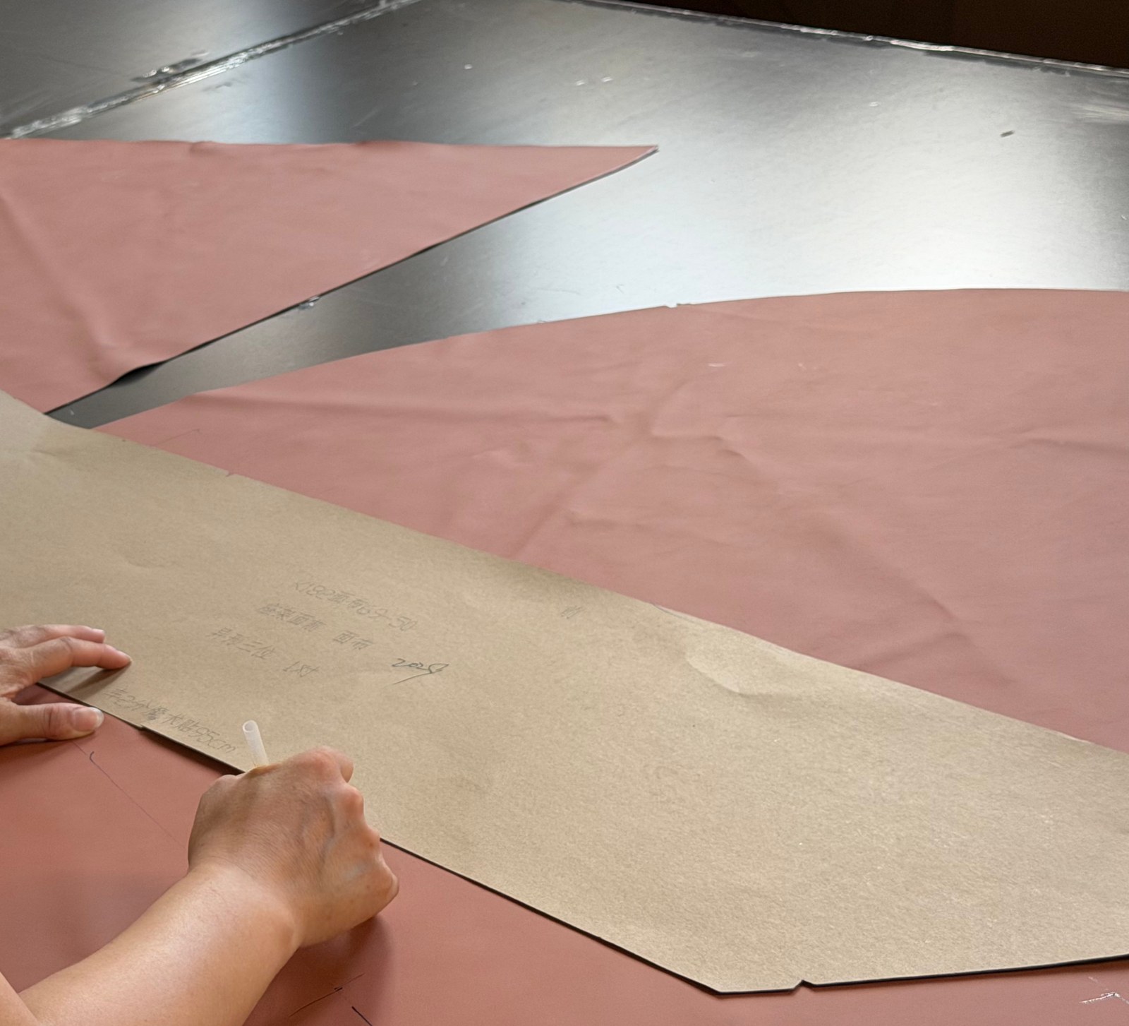Furniture upholstery patterns being marked from a production template