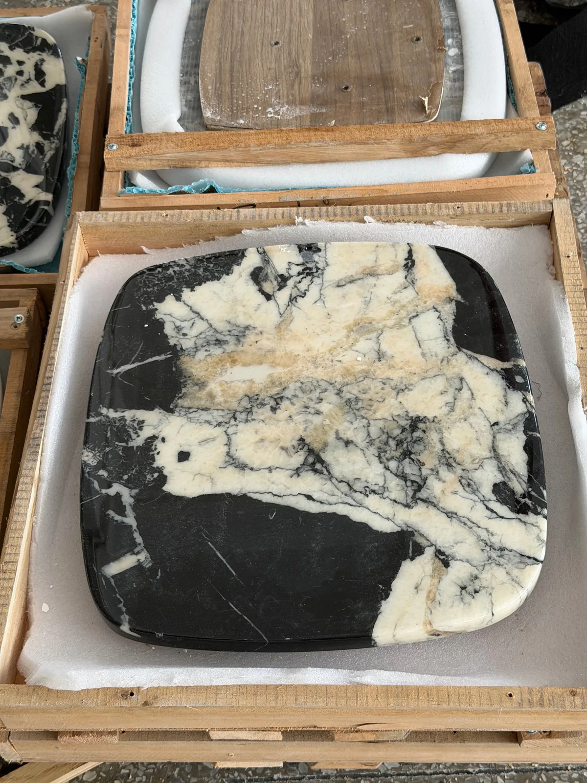Stone furniture component protected inside a wooden export crate