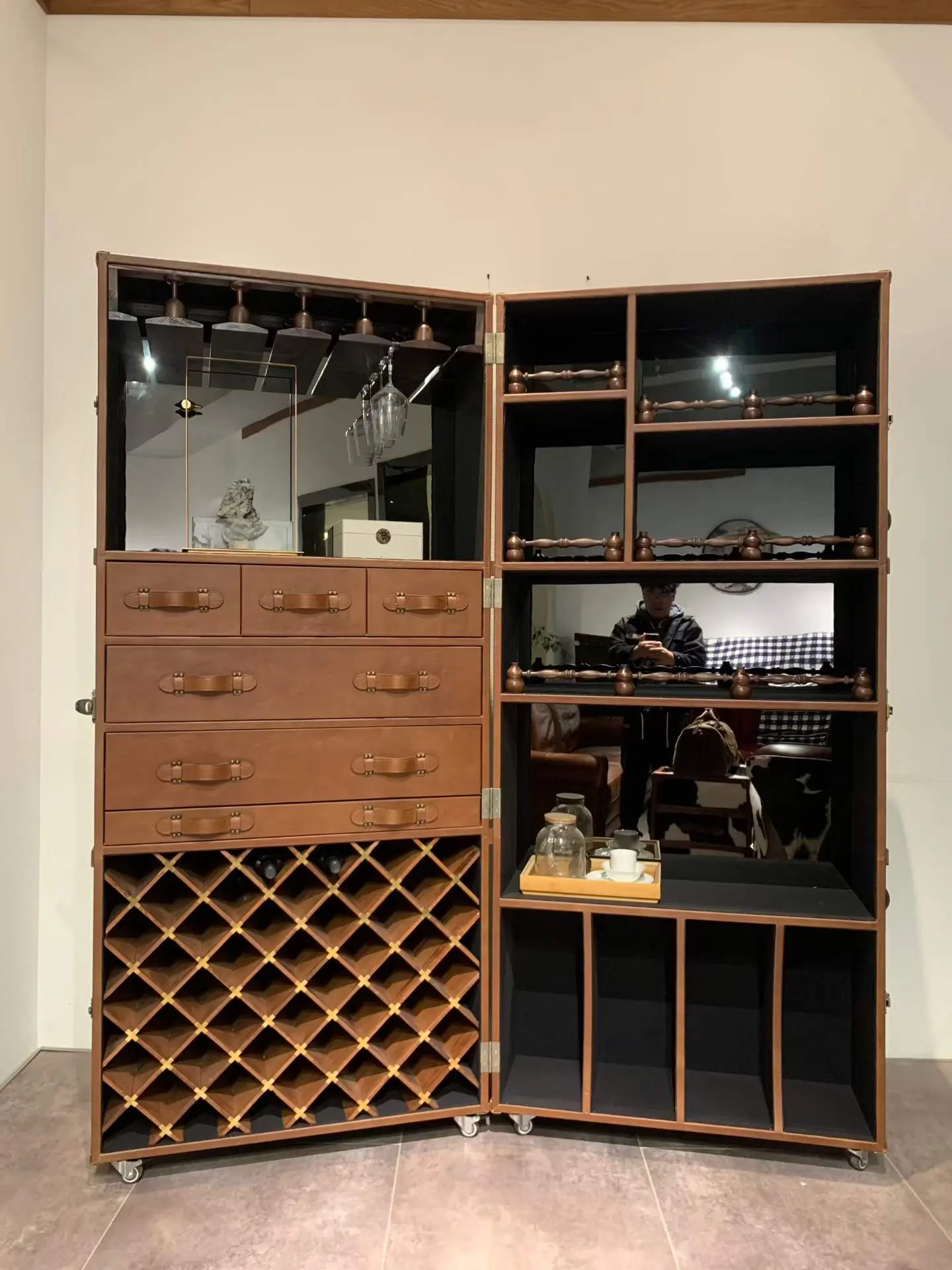 Open custom folding bar cabinet with drawers racks and mirrored interior