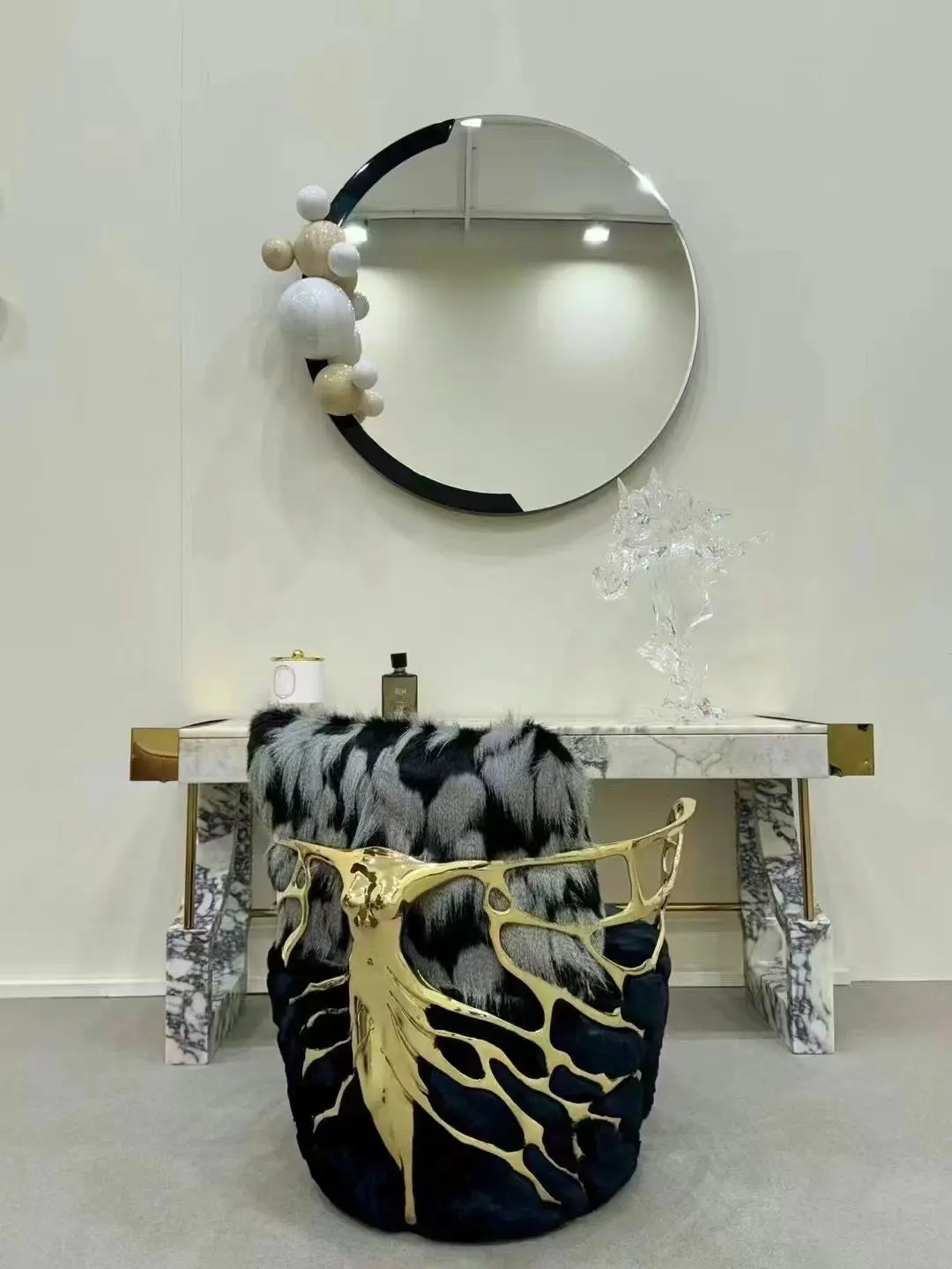 Decorative console table round mirror and sculptural accent chair