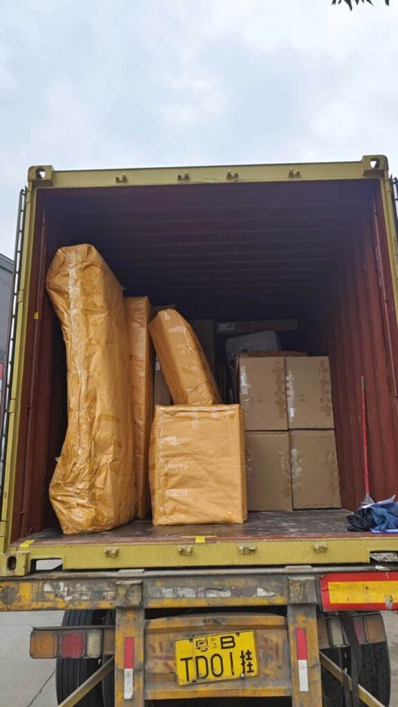 Wrapped furniture packages arranged inside an export container