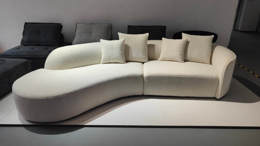 FX8008 archive view B: cream curved sofa with extended rounded end on the viewer’s left.