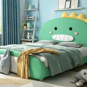 L78 green dinosaur bed with yellow headboard spikes, black eyes, pink cheeks, and a rounded green footboard