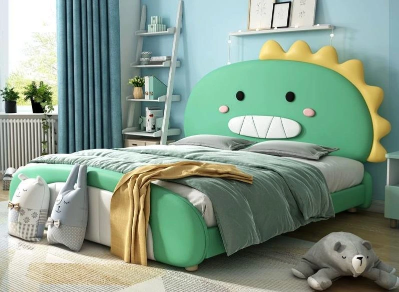 L78 green dinosaur bed with yellow headboard spikes, black eyes, pink cheeks, and a rounded green footboard