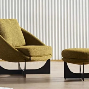 Mustard LC23-35 sculptural lounge chair with a curved shell and dark geometric base shown beside a round ottoman