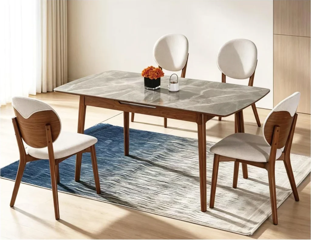 SYL601 dining table with a pale veined top and four Y71 upholstered chairs in a bright dining room