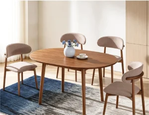 SYL603 oval dining table with a brown finish and four Y68 chairs with curved upholstered backs and seats