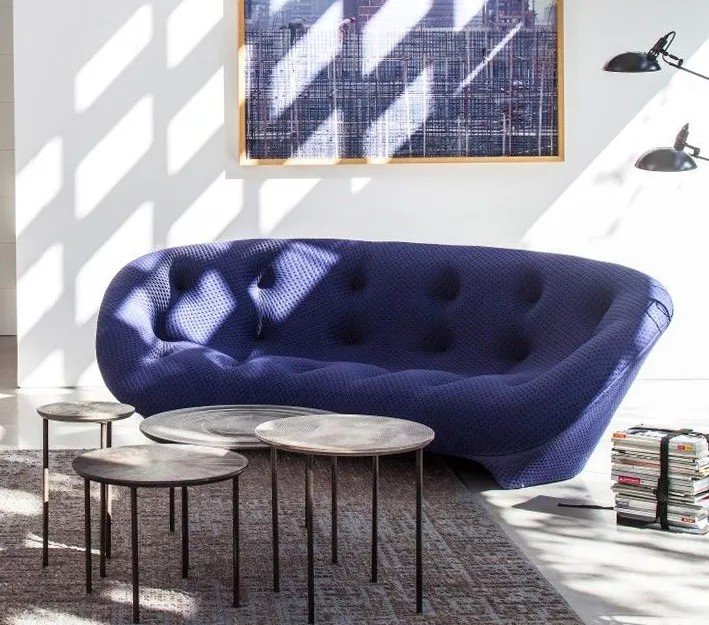 Blue rounded sofa in the Lenatees archive folder labelled 1181, styled with separate round tables.
