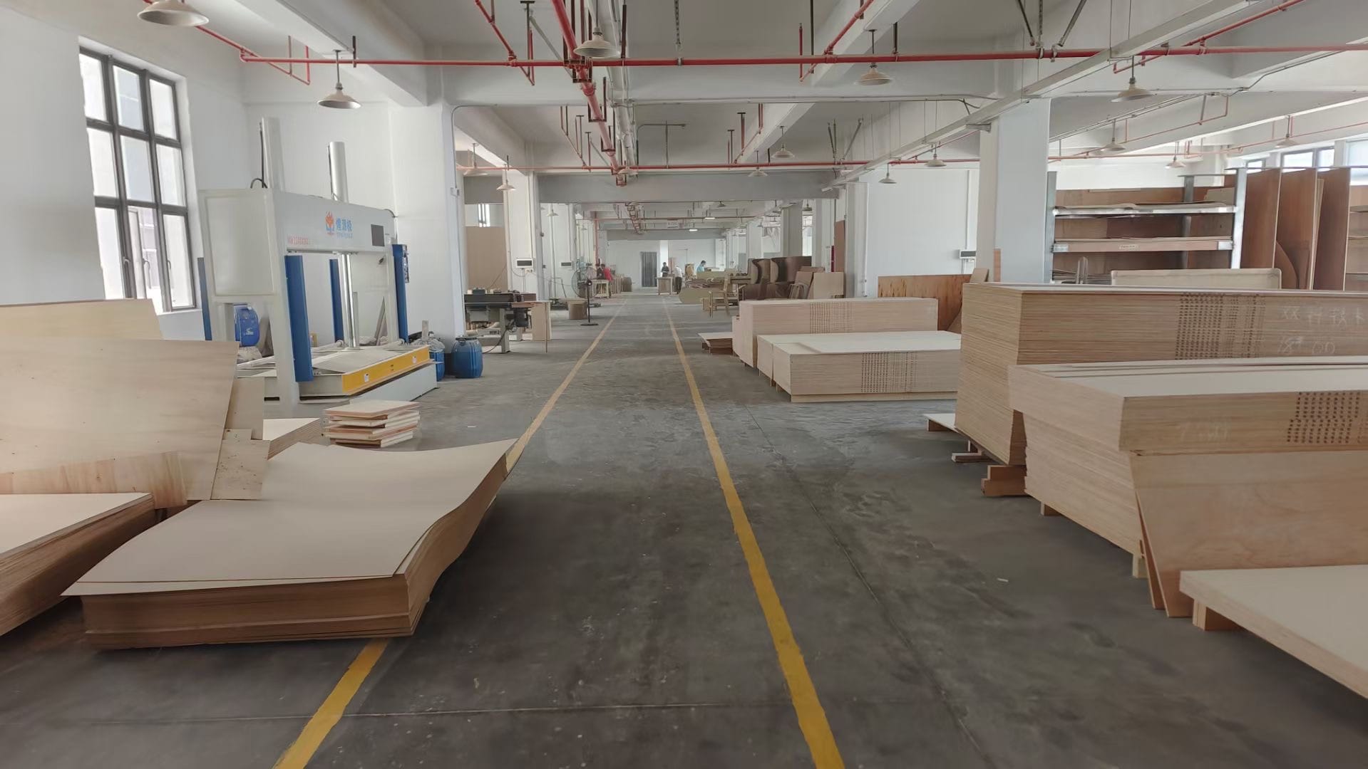 Woodworking area and stacked board material in the Lenatees production archive